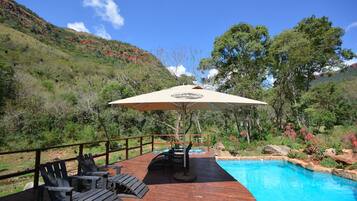 Outdoor pool, open 8:00 AM to 6:00 PM, pool umbrellas, sun loungers