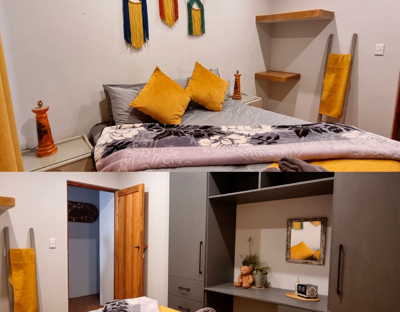 A bedroom with a bed, a wardrobe, a small table with a plant, and a mirror.