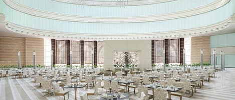 A spacious, multi-level dining area with tiered seating and a high ceiling with skylights.