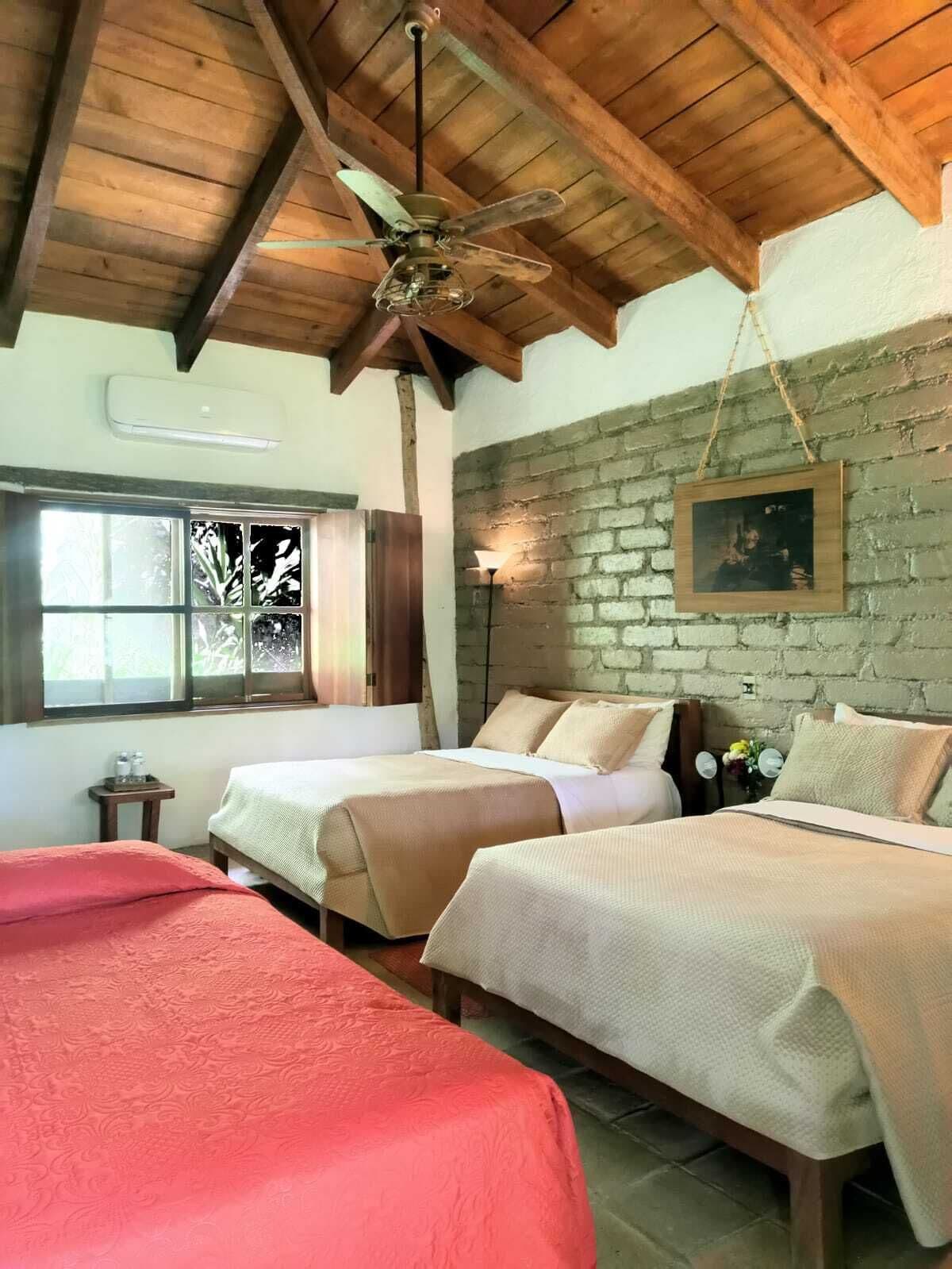 deluxe triple room, multiple beds, garden view | 1 bedroom, desk, bed sheets