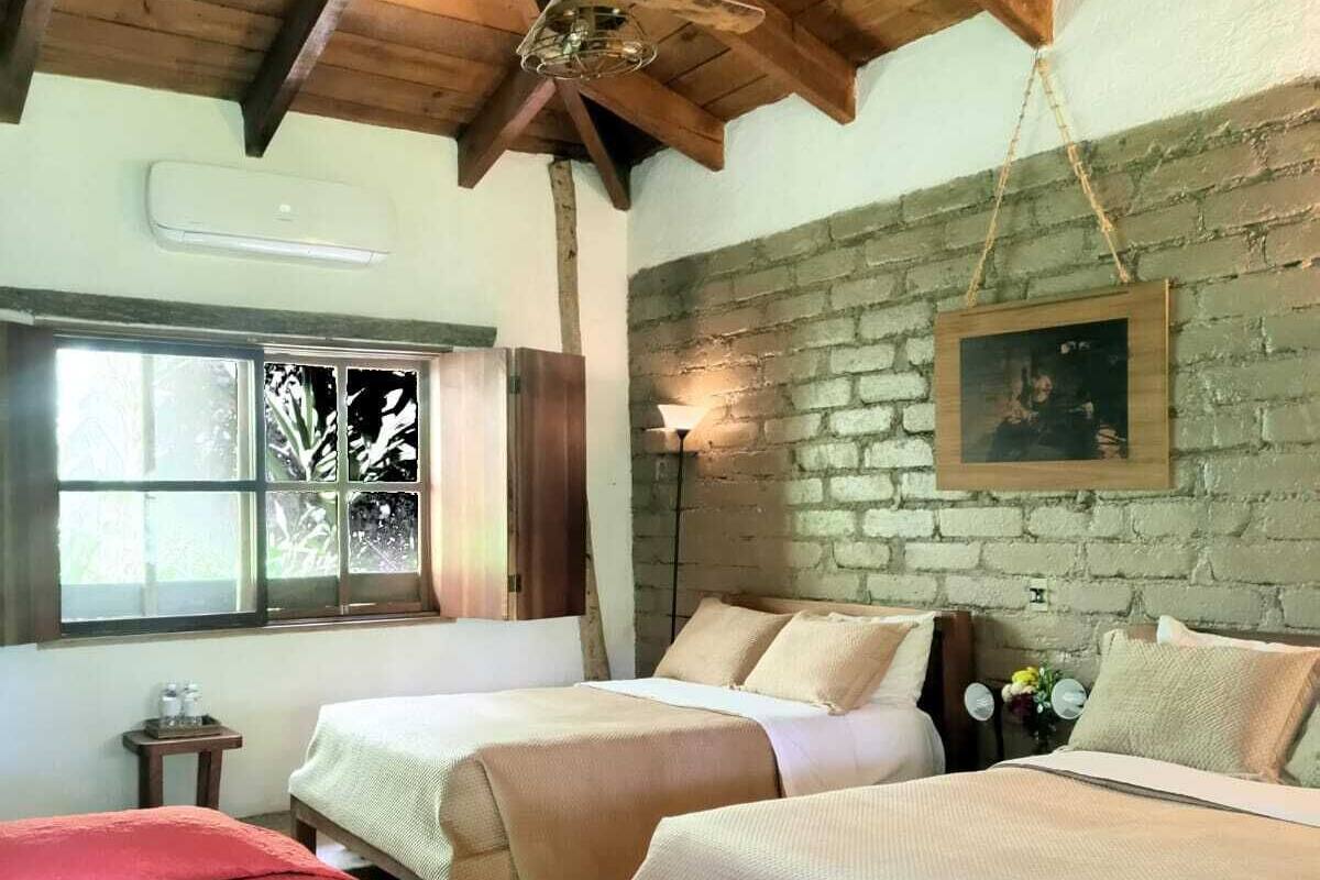 deluxe triple room, multiple beds, garden view | 1 bedroom, desk, bed sheets