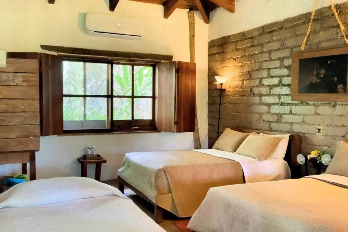 deluxe triple room, multiple beds, garden view | 1 bedroom, desk, bed sheets