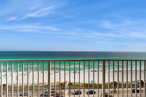 Enjoy the ocean view from this beachfront balcony with access to the sandy beach and recreational area.