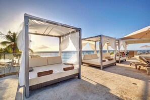 Outdoor pool, open 7:00 AM to 6:00 PM, pool umbrellas, sun loungers