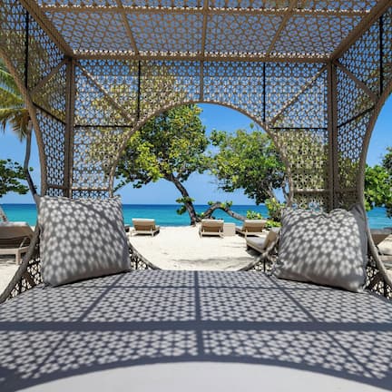 On the beach, beach cabanas, beach umbrellas, beach towels