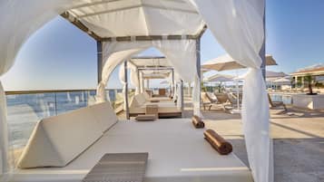 Outdoor pool, open 7:00 AM to 6:00 PM, pool umbrellas, pool loungers