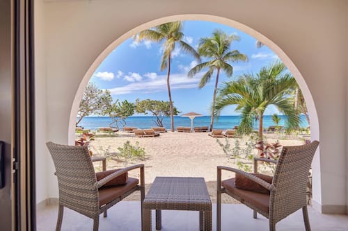 On the beach, beach cabanas, beach umbrellas, beach towels