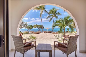 On the beach, beach cabanas, beach umbrellas, beach towels