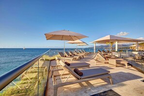 Outdoor pool, sun loungers, lifeguards on site