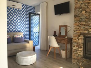 Comfort Suite, Balcony | Living area | Flat-screen TV, fireplace