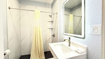Standard Room, 1 King Bed | Bathroom | Combined shower/bathtub, rainfall showerhead, towels, soap