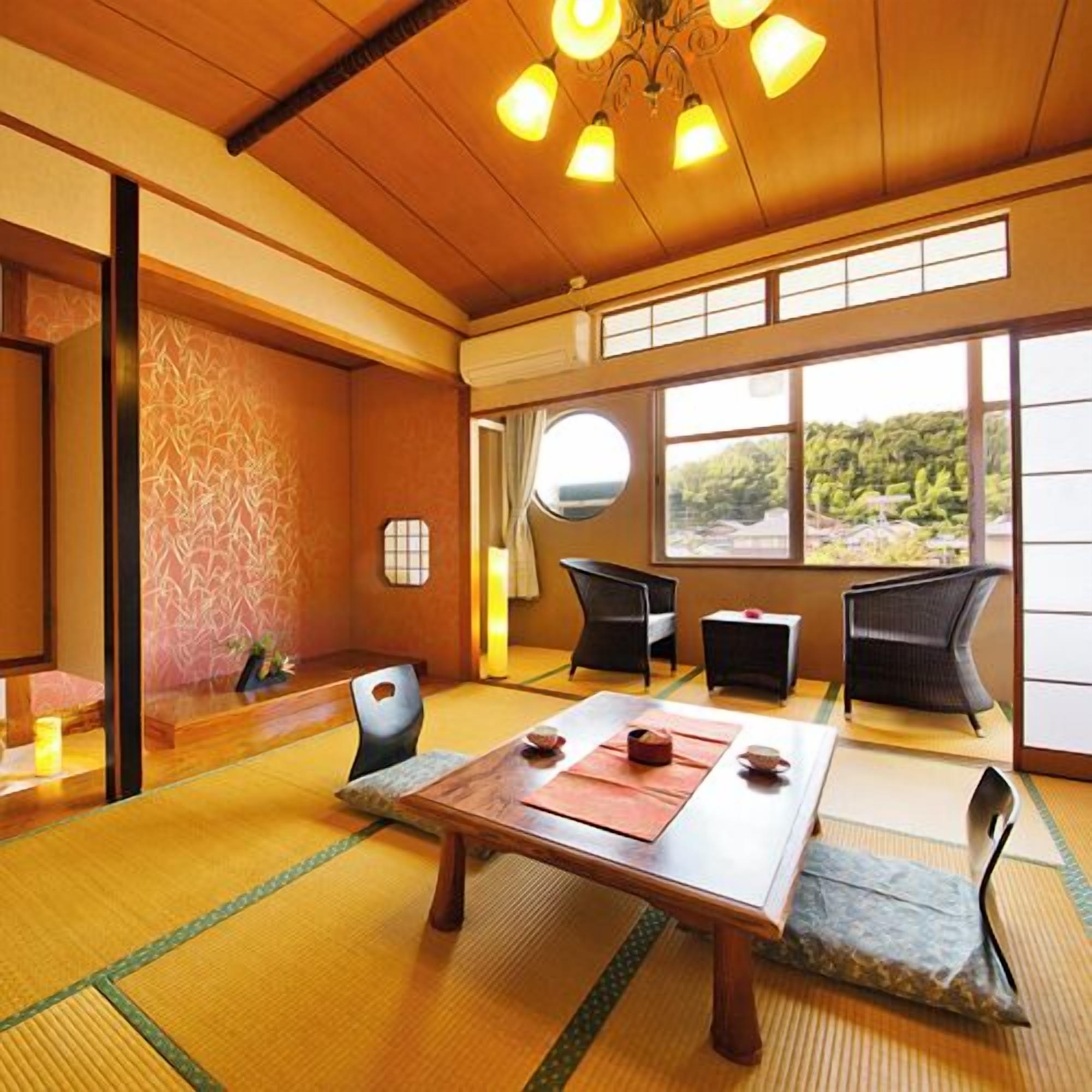 A traditional Japanese room with tatami flooring, a low table with tea set, and a view of a forest through large windows.