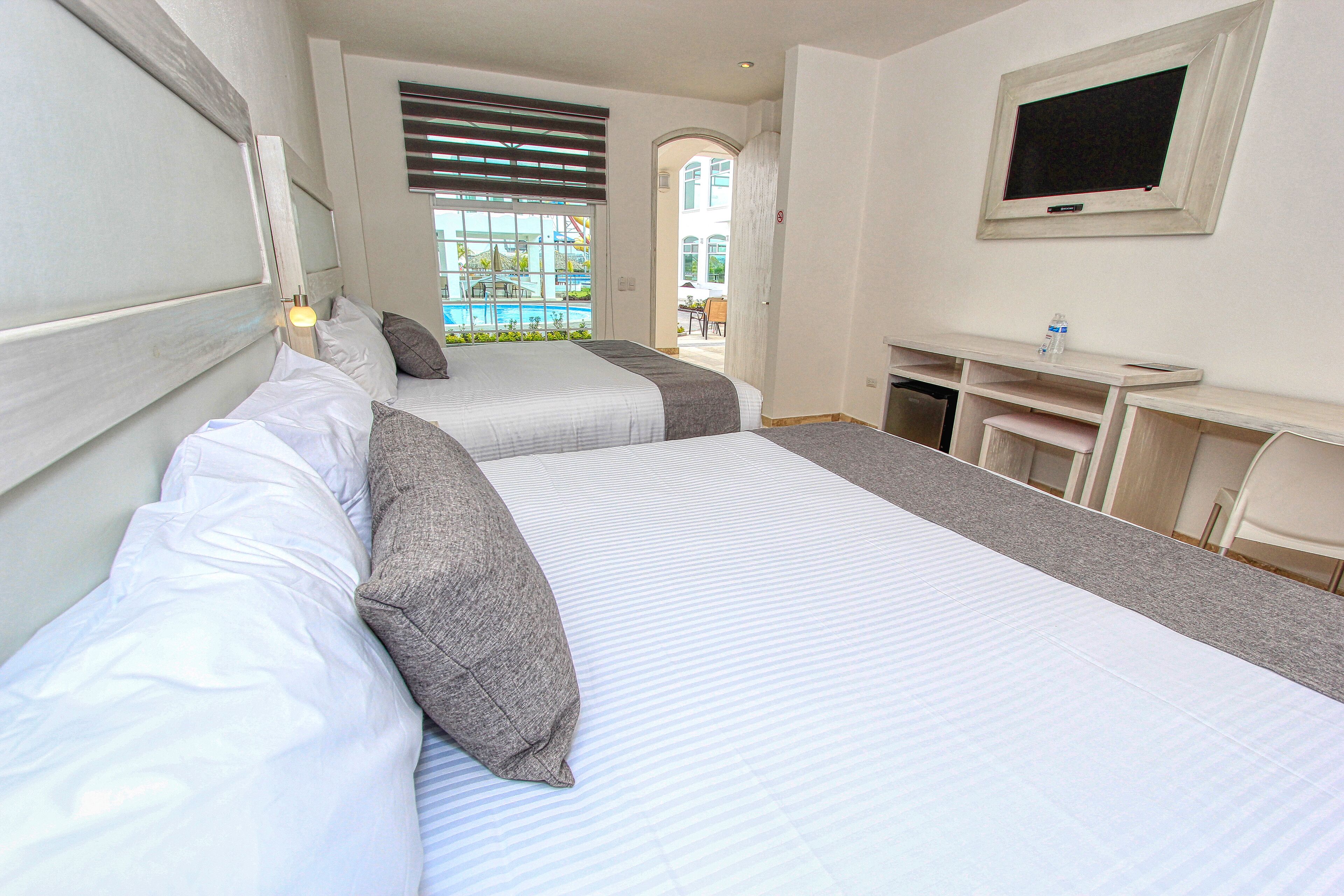 standard room, multiple beds | minibar, desk, blackout curtains, iron/ironing board