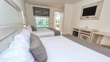 Standard Room, Multiple Beds | Minibar, desk, blackout drapes, iron/ironing board