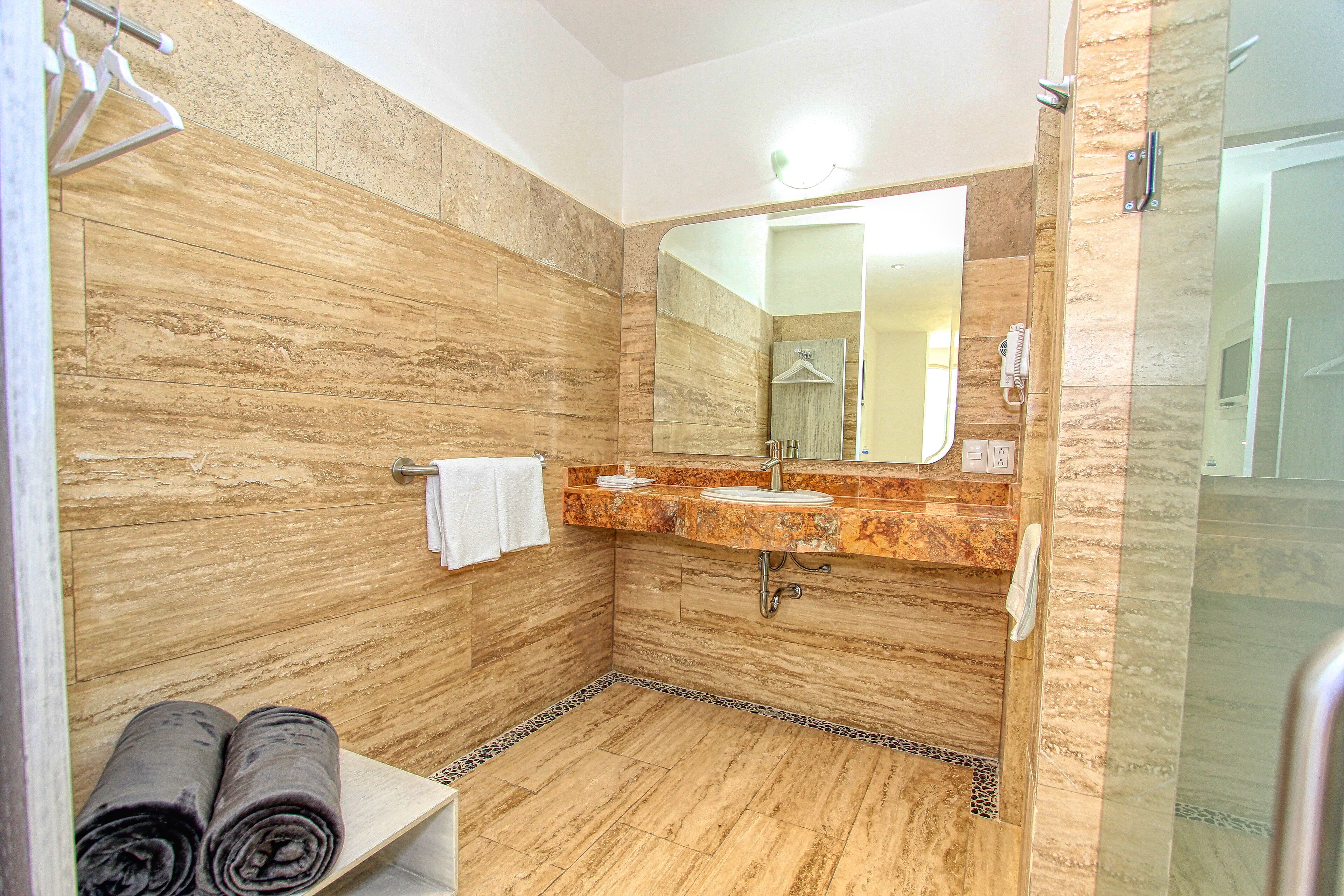 standard room, multiple beds | bathroom sink