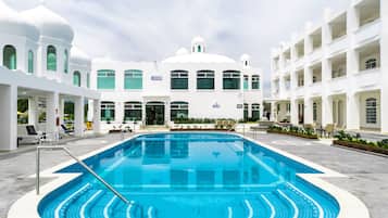 2 outdoor pools, open 9:00 AM to 9:00 PM, pool umbrellas, pool loungers