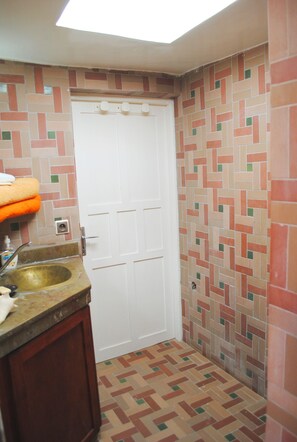 Shower, hair dryer, towels, toilet paper