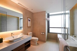 Suite, 1 King Bed with Sofa bed | Bathroom | Combined shower/tub, designer toiletries, hair dryer, bathrobes