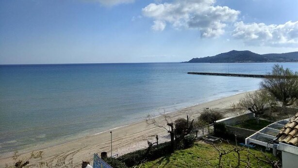 A coastal view with a beach, clear sky, and distant mountains. - Zakynthos-Summer Sea View (Zakynthos)