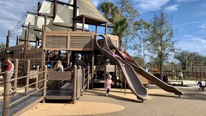 A pirate-themed play structure with slides and climbing areas. - NEW RESORT-STYLE POOL, CUTE HOUSE, 88 STEPS TO SAND! (Hilton Head Island)