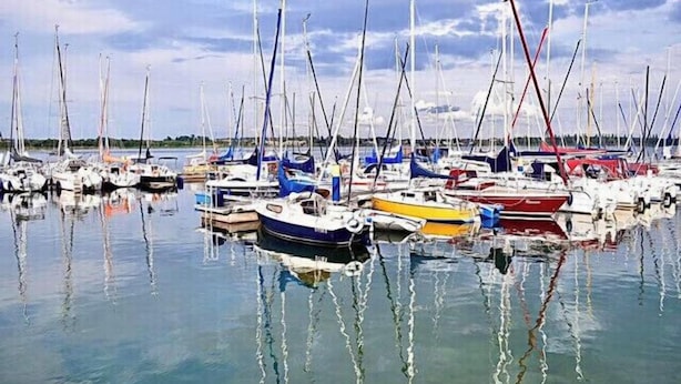 A marina with numerous sailboats docked in calm waters. - A holiday house / apartment with a difference - with a sauna in the living area.  (Löbnitz)