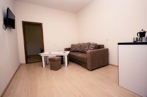 Premium bedding, blackout curtains, soundproofing, iron/ironing board