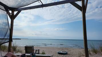 On the beach, sun loungers, beach towels