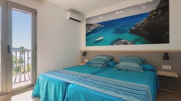 Standard Twin Room, Balcony, Sea View | Minibar, in-room safe, iron/ironing board, free WiFi