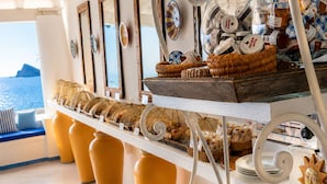 A buffet setup with various food items and decorative elements.