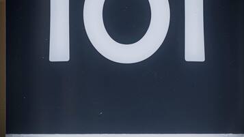 A sign with the number 101 and the text "Via Esino".