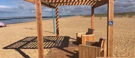 On the beach, sun-loungers