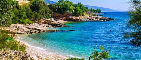 On the beach, sun-loungers