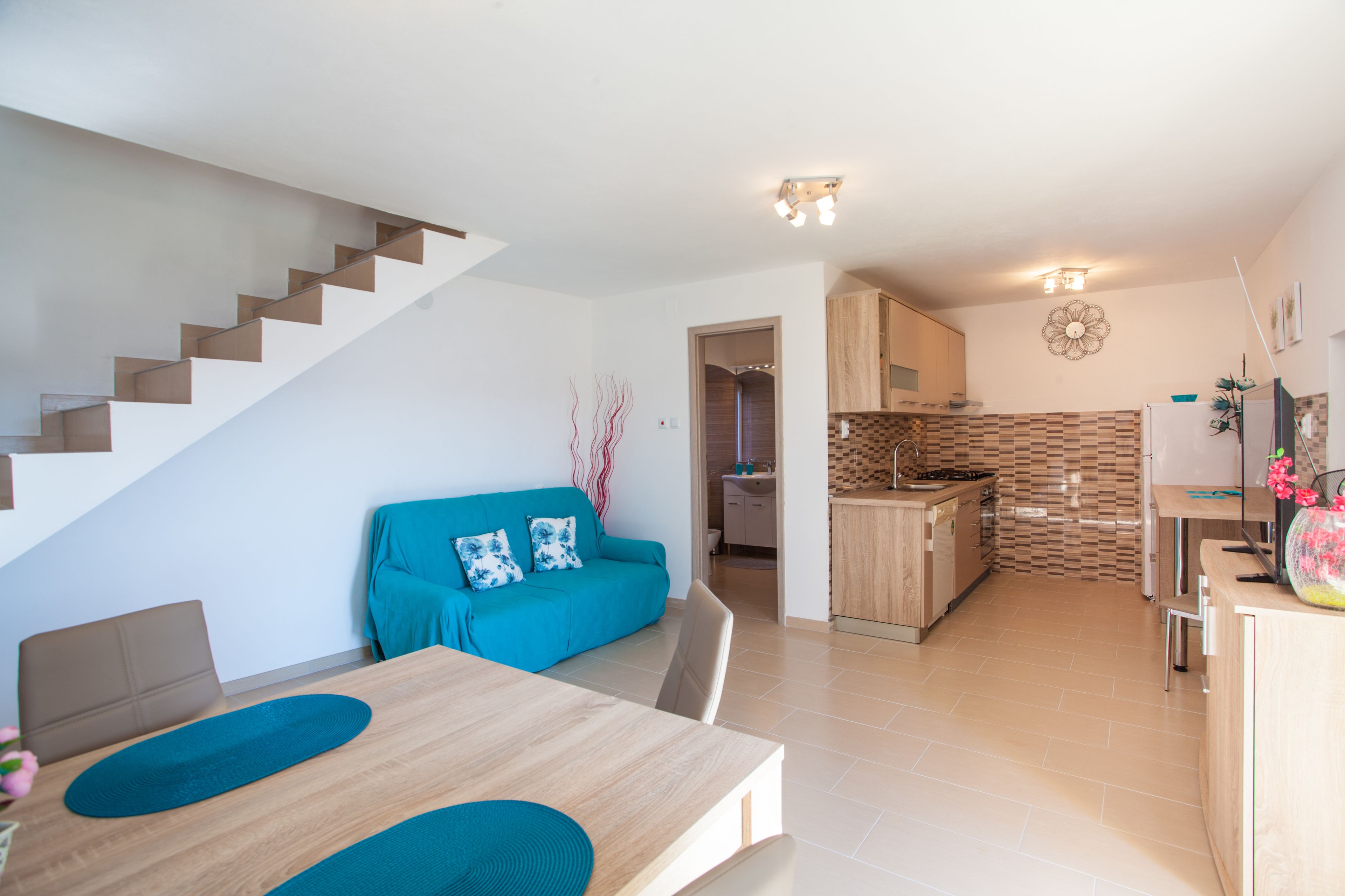 Basic Apartment, Lake View | Living area | Flat-screen TV