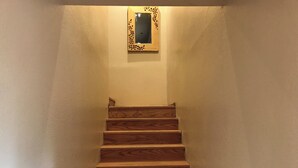 A wooden staircase with a small mirror at the top. - Grand Canyon Loft/Suite at Historic Wrigley Ranch-Horseback Ride-Target Shoot! (Parks)