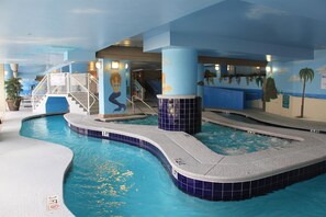 An indoor swimming pool with a 3 FT depth marker, a mural of a mermaid, and a staircase leading to a higher level. - Amazing Oceanfront 2 Bed 2 Bath Condo in Myrtle Beach (Myrtle Beach)