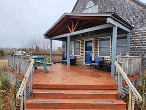 Terrace/patio - Beautiful and modern cape style cottage nested along the Jordan Tidal River. (Lamoine)