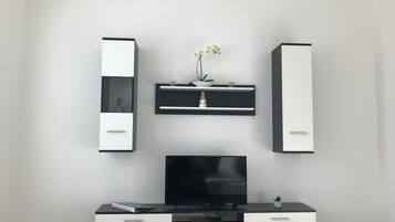 Premium Apartment, Multiple Beds, Mountain View | Living area | TV