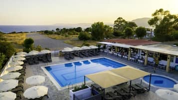 Seasonal outdoor pool, open 7:00 AM to 7:00 PM, pool umbrellas