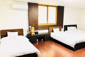 Family Suite, Multiple Beds, City View | Desk, laptop workspace, free WiFi, bed sheets