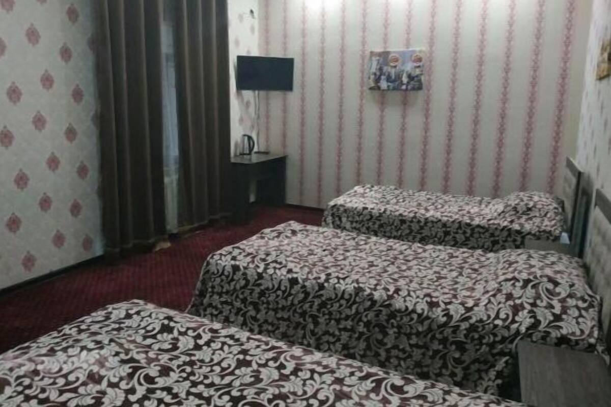 Basic Triple Room, 3 Twin Beds | Living area