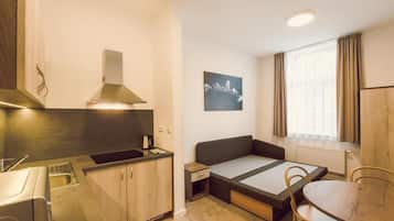 Executive Room, 2 Bedrooms, Ground Floor | Living area | Flat-screen TV