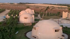 A series of dome-shaped structures in a landscaped area with a clear view of the surrounding landscape. - Luxury villa with private pool not overlooked. (Fès)