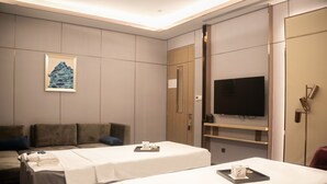 A hotel room with two beds, a sofa, a television, and a painting on the wall. - Pullman Suzhou Zhonghui (Suzhou)