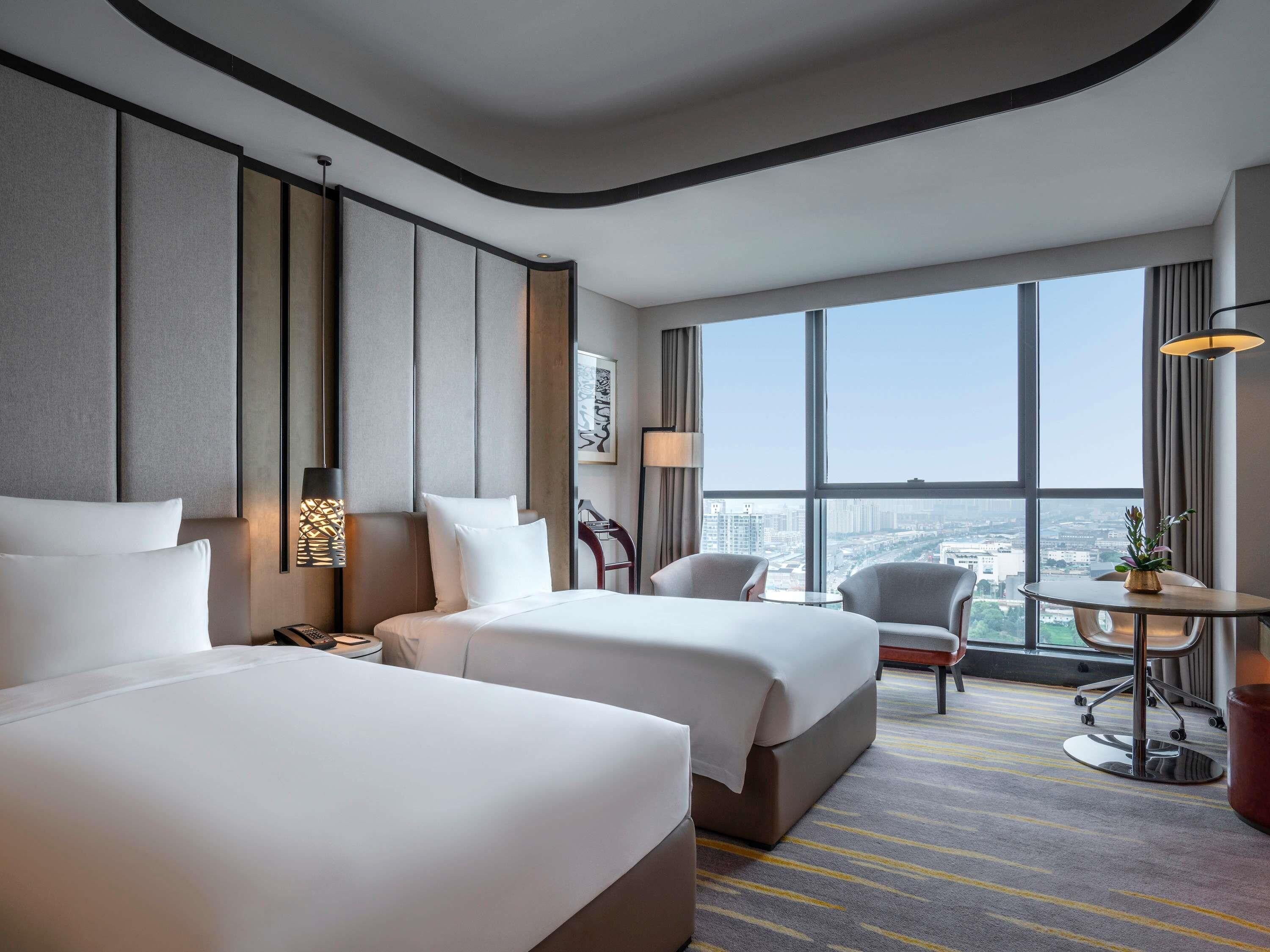 Premium bedding, down comforters, pillowtop beds, minibar