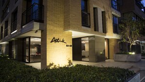 A modern building with a visible storefront labeled "Atik" and a well-maintained garden area in front. -  ATTIK SUPERIOR -501 (Bogotá)