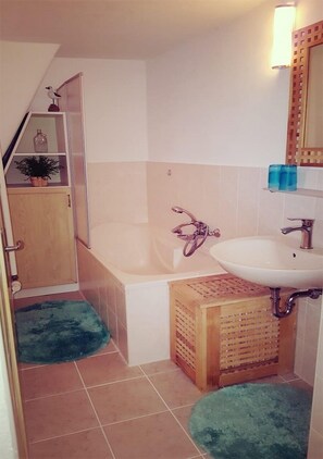 Combined shower/tub, hair dryer, towels, toilet paper