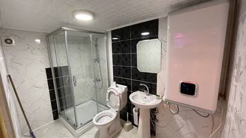 Shower, free toiletries, hair dryer, slippers