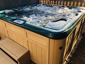 A wooden hot tub with a control panel and a wooden bench. - The Peakview- with private hot tub! (Flagstaff)