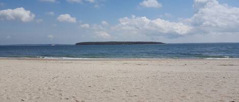 On the beach, sun loungers, beach towels