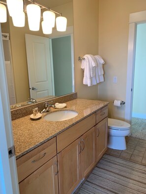 Combined shower/bathtub, hair dryer, towels, soap
